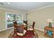 Bright breakfast nook with glass table and pool view at 521 Wedge Ln, Longboat Key, FL 34228