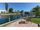 Relaxing canal view from patio, perfect for enjoying the Florida sunshine at 521 Wedge Ln, Longboat Key, FL 34228