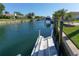 View down canal showcasing neighborhood and boats at 521 Wedge Ln, Longboat Key, FL 34228