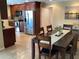 Dining area with adjacent kitchen and home office at 521 Wedge Ln, Longboat Key, FL 34228