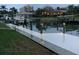 Well-lit private dock at night, offering convenient boat access at 521 Wedge Ln, Longboat Key, FL 34228