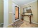 Bright entryway with decorative door and console table at 521 Wedge Ln, Longboat Key, FL 34228