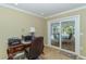 Home office with desk, chair, and view of the pool at 521 Wedge Ln, Longboat Key, FL 34228