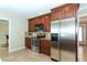 Kitchen with stainless steel appliances and wood cabinets at 521 Wedge Ln, Longboat Key, FL 34228