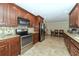 Kitchen features stainless steel appliances and wood cabinets at 521 Wedge Ln, Longboat Key, FL 34228