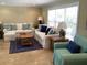 Spacious living room with ample natural light and seating at 521 Wedge Ln, Longboat Key, FL 34228