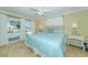 Main bedroom with king bed and sliding doors to pool at 521 Wedge Ln, Longboat Key, FL 34228