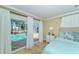 Main bedroom with pool view and king-size bed at 521 Wedge Ln, Longboat Key, FL 34228