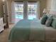 Main bedroom with water views and direct pool access at 521 Wedge Ln, Longboat Key, FL 34228