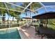 Enjoy this screened-in pool and patio area at 521 Wedge Ln, Longboat Key, FL 34228