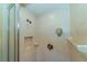 Clean shower with beige tile and a glass enclosure at 521 Wedge Ln, Longboat Key, FL 34228