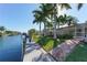 Landscaped waterfront lot with canal access and dock at 521 Wedge Ln, Longboat Key, FL 34228