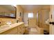 Updated bathroom with double vanity and shower/tub combo at 5415 8Th Avenue W Dr, Bradenton, FL 34209