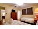 Bedroom with two twin beds and adjacent bathroom at 5415 8Th Avenue W Dr, Bradenton, FL 34209