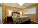 Guest bedroom with hardwood floors, ceiling fan, and coastal decor at 5415 8Th Avenue W Dr, Bradenton, FL 34209