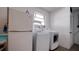 Laundry room with washer, dryer, and refrigerator at 5415 8Th Avenue W Dr, Bradenton, FL 34209