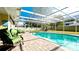 Enjoy this refreshing pool area with covered patio and comfortable seating at 5415 8Th Avenue W Dr, Bradenton, FL 34209