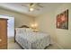 Bedroom with double bed, ceiling fan and wooden dresser at 6115 39Th W Ave, Bradenton, FL 34209