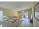 Bright living room with tiled floors and sliding glass doors leading to the pool at 6115 39Th W Ave, Bradenton, FL 34209