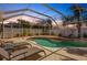 Evening view of the screened pool and patio area at 6115 39Th W Ave, Bradenton, FL 34209