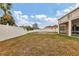 Large backyard with fire pit and privacy fence at 6172 42Nd Street E St, Bradenton, FL 34203