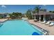 Refreshing community pool with a slide and a shaded seating area at 6172 42Nd Street E St, Bradenton, FL 34203