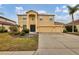 Two-story house with a large driveway and landscaped yard at 6172 42Nd Street E St, Bradenton, FL 34203