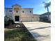 Two-story house with a three-car garage and landscaping at 6172 42Nd Street E St, Bradenton, FL 34203