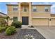 Two-story house exterior featuring a dark-colored front door and attached garage at 6172 42Nd Street E St, Bradenton, FL 34203