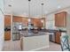 Kitchen with island, stainless steel appliances, and wood cabinets at 6172 42Nd Street E St, Bradenton, FL 34203