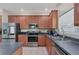 Well-equipped kitchen boasting stainless steel appliances and dark countertops at 6172 42Nd Street E St, Bradenton, FL 34203