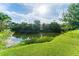 Serene lake view with green grass at 6172 42Nd Street E St, Bradenton, FL 34203