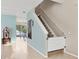 Staircase with white farmhouse-style gate and jukebox at 6172 42Nd Street E St, Bradenton, FL 34203