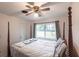 Bright bedroom with a double bed and window overlooking the backyard at 6222 Brentwood Ave, Sarasota, FL 34231