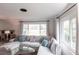 Light-filled living room with a comfortable sectional sofa at 6222 Brentwood Ave, Sarasota, FL 34231