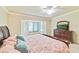 Spacious Primary bedroom with a king-size bed and large windows at 6705 Grand Estuary Trl # 201, Bradenton, FL 34212