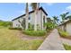 Building exterior with lush landscaping at 6705 Grand Estuary Trl # 201, Bradenton, FL 34212