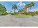 Community clubhouse with palm trees at 6705 Grand Estuary Trl # 201, Bradenton, FL 34212