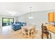 Dining area with a wood table and chairs, adjacent to the kitchen at 6705 Grand Estuary Trl # 201, Bradenton, FL 34212