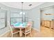 Charming dining room with white table and turquoise placemats at 6705 Grand Estuary Trl # 201, Bradenton, FL 34212