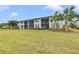 Building exterior with balconies and lush lawn at 6705 Grand Estuary Trl # 201, Bradenton, FL 34212