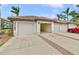 Attached garage with three garage doors and brick pavers at 6705 Grand Estuary Trl # 201, Bradenton, FL 34212