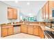 Open concept kitchen with granite countertops and ample cabinet space at 6705 Grand Estuary Trl # 201, Bradenton, FL 34212