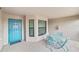 Small patio with blue metal table and chairs at 6705 Grand Estuary Trl # 201, Bradenton, FL 34212