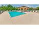 Community pool with lounge chairs and a cabana at 6705 Grand Estuary Trl # 201, Bradenton, FL 34212