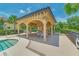 Community pool area with cabana and seating at 6705 Grand Estuary Trl # 201, Bradenton, FL 34212