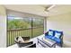 Relaxing screened porch with seating and nature views at 6705 Grand Estuary Trl # 201, Bradenton, FL 34212