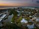 Aerial view showing home's waterfront location at 6821 Longboat S Dr, Longboat Key, FL 34228