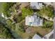 Bird's eye view of waterfront property, showcasing the house and canal at 6821 Longboat S Dr, Longboat Key, FL 34228