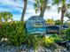 Nar Vista Dockside Restaurant & Pub sign with tropical plants at 6821 Longboat S Dr, Longboat Key, FL 34228